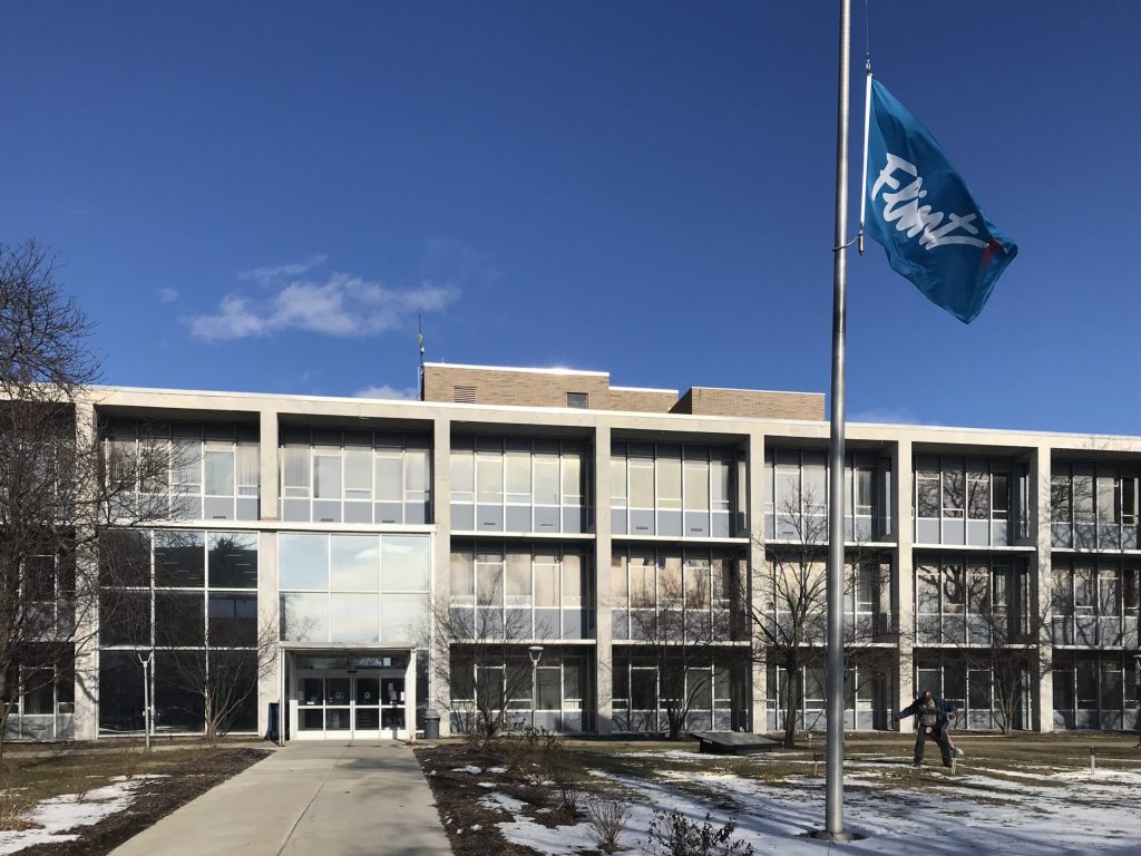 Mayor Neeley lowers city flag in honor of Richard Dicks, whose service helped create Flint ombudsman’s office