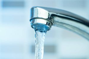 Pouring water from a Faucet high quality and high resolution studio