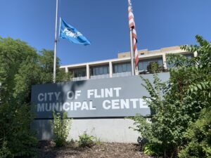 The front of City Hall showing the sign reading City of Flint Municipal Center