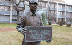 Statue at City Hall showing Auto Worker holding a plaque