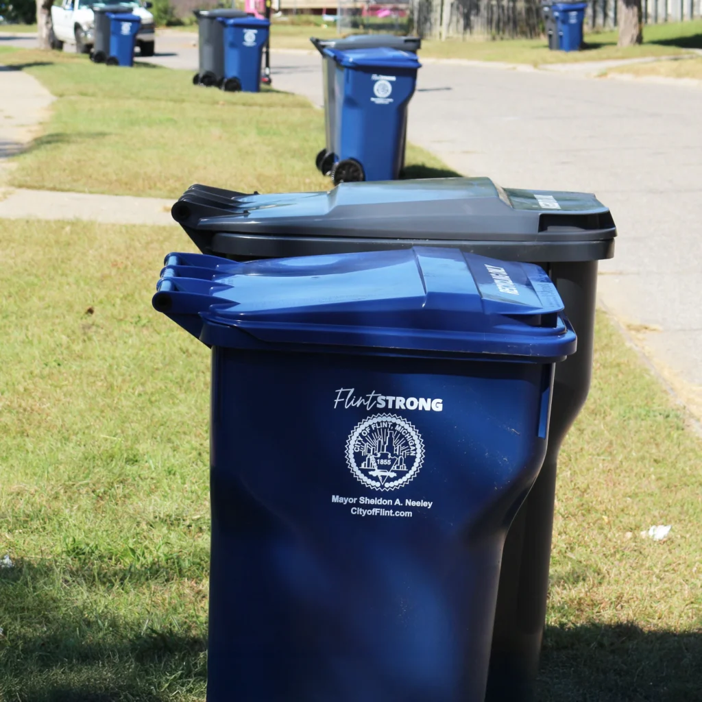 Trash carts on side of street