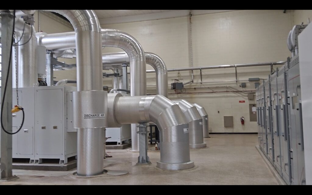 Picture of newly installed water pipes and machinery in a facility