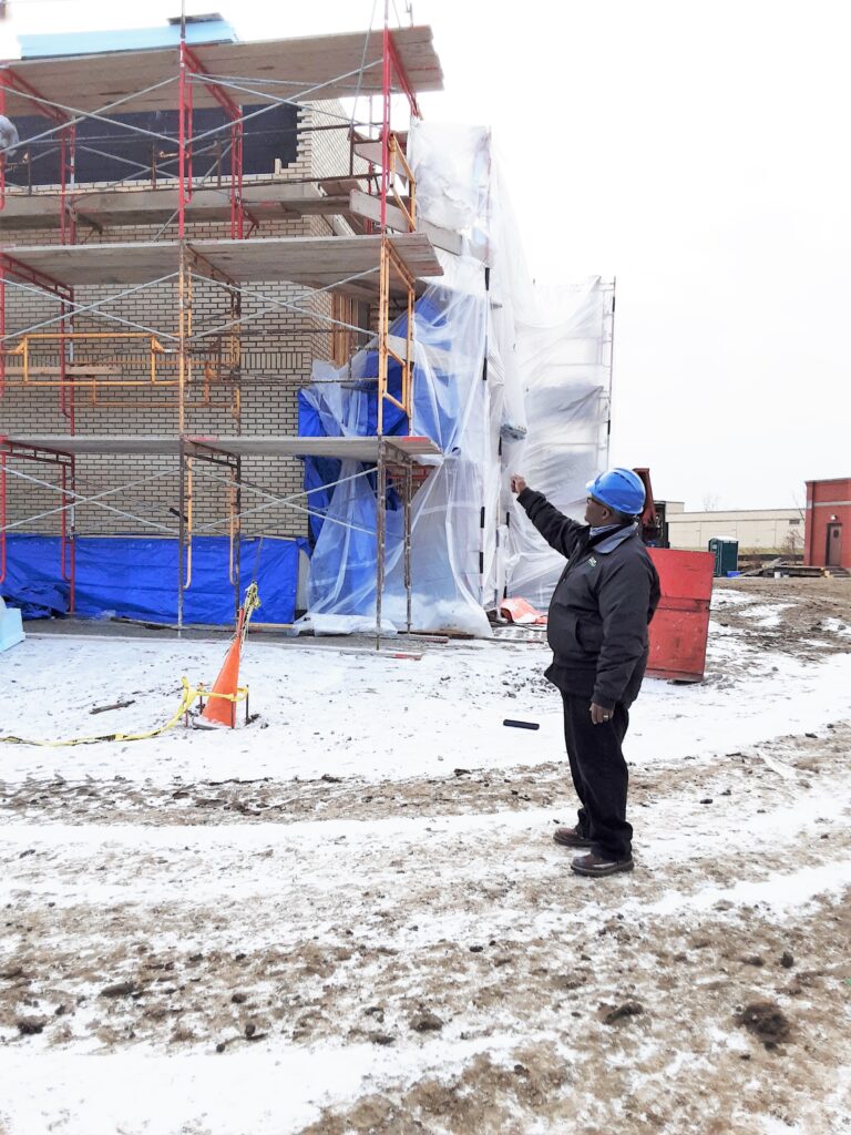 Oversight. City Administrator Clyde Edwards on site of a construction site.