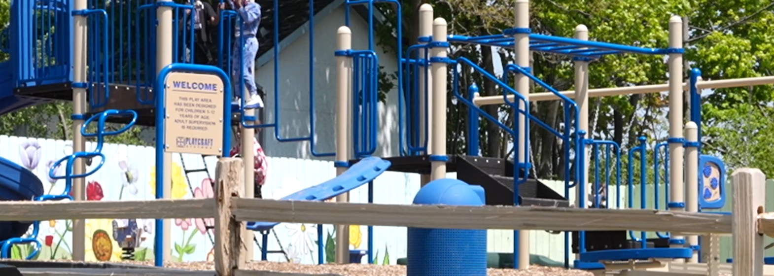 A playground in the Avenue Greenspace Park with children playing