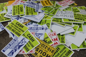 A pile of illegally place signs collected by City Neighborhood Safety Officers.