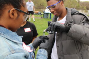 Flint Southwestern Academy students conduct a water sample test.