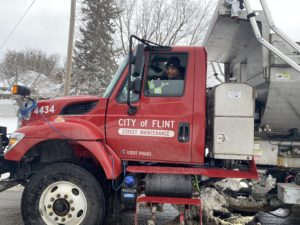 Flint crews continue working hard to clean streets after large snowfall