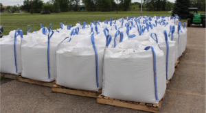 Bags of sand which will serve as the bed for the granulated activated carbon (GAC) wait to be loaded into the filter.