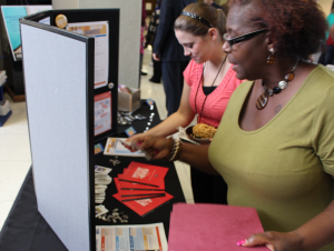 City of Flint employees examine the many programs available to which they can make their charitable contributions.